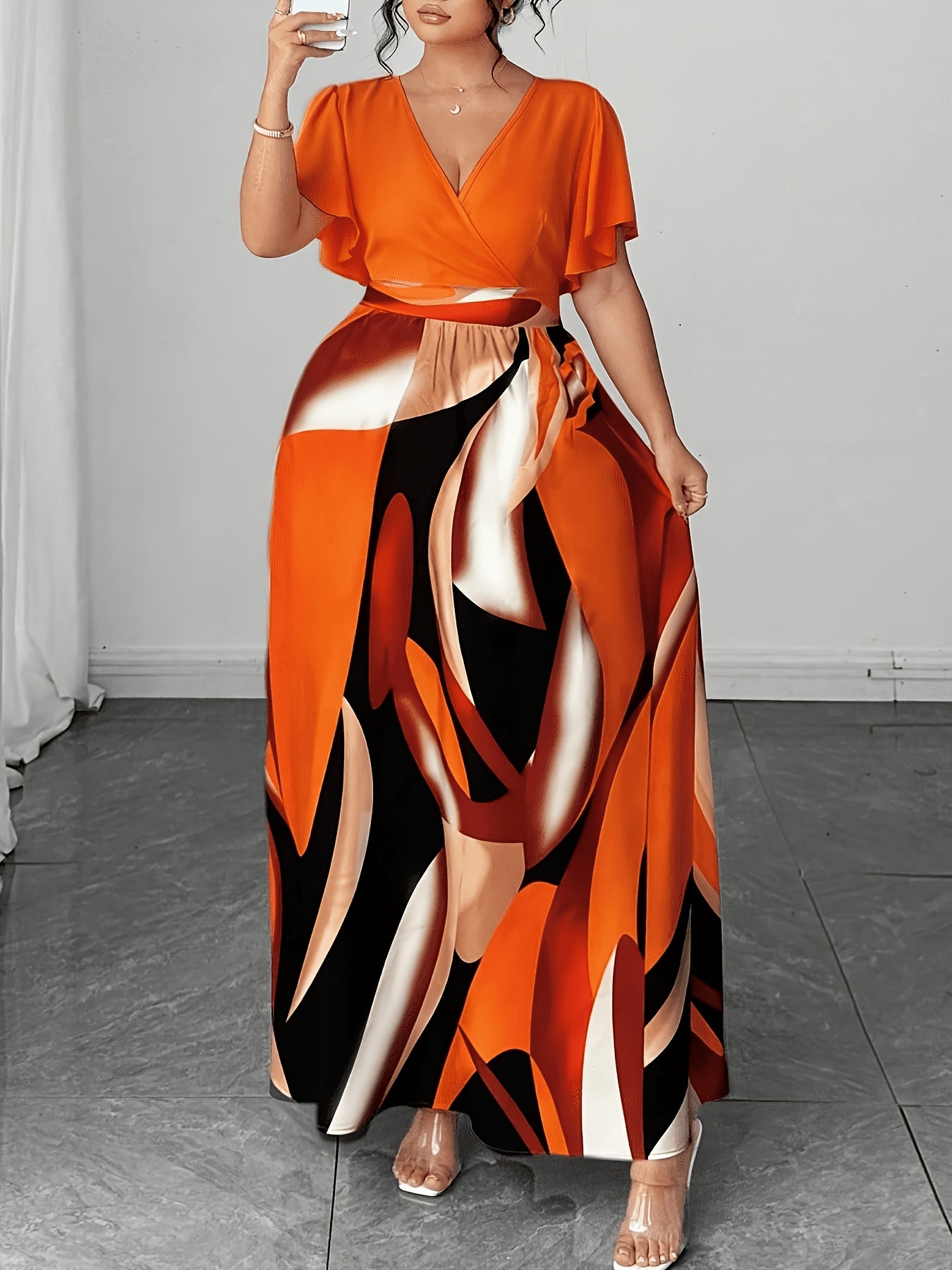 Elegant Orange Abstract Print Maxi Dress for Women with V Neck Flutter Sleeve Cutout Waist Flowing Style