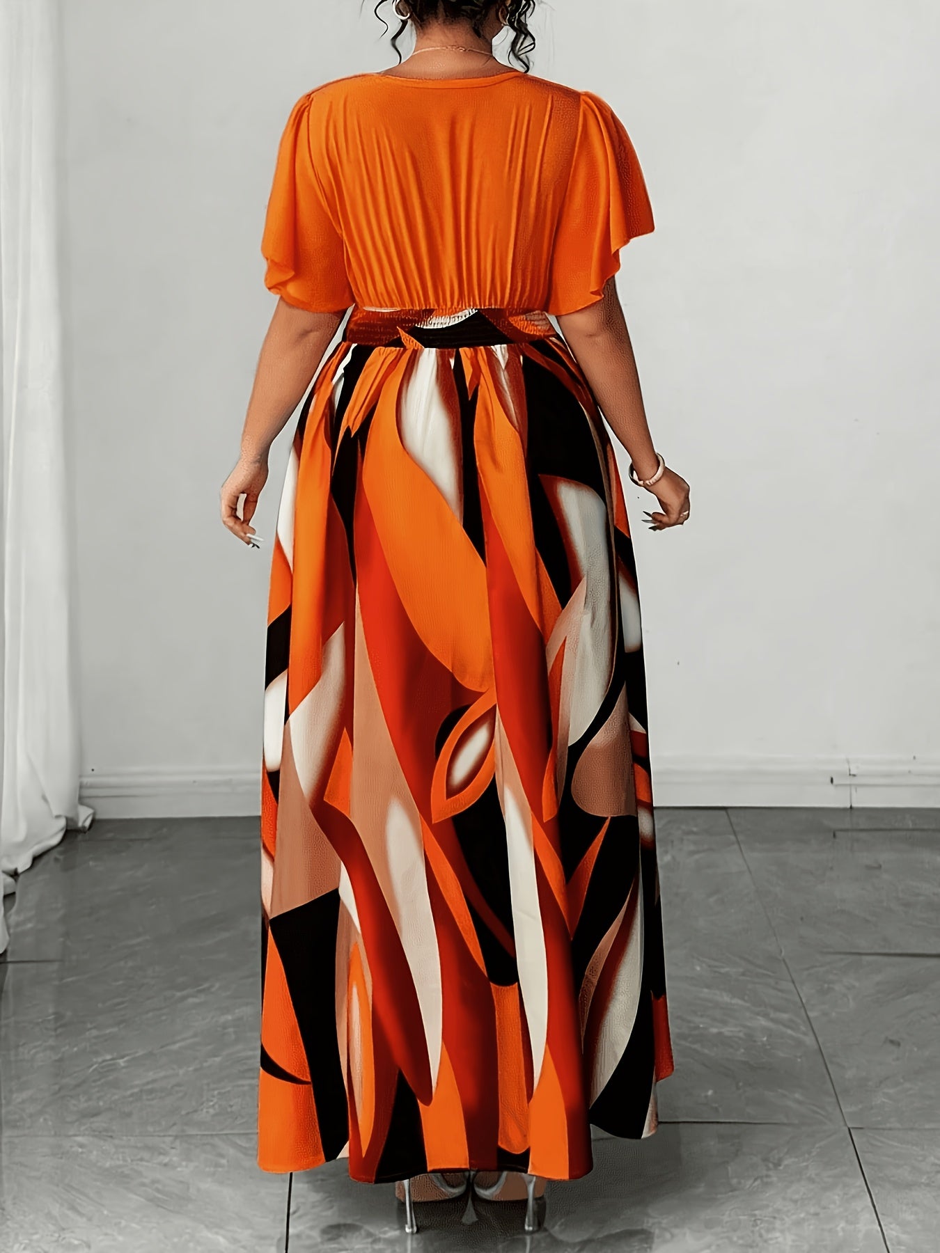 Elegant Orange Abstract Print Maxi Dress for Women with V Neck Flutter Sleeve Cutout Waist Flowing Style
